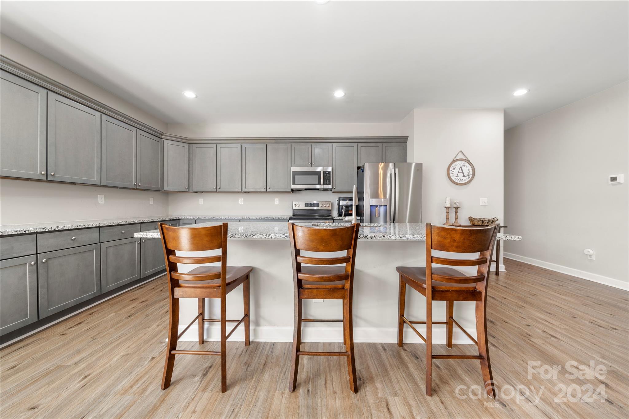 218 Rambler Lane Blacksburg, SC 29702 - Photo 17 of 42 a open kitchen with stainless steel appliances wooden floors and wooden cabinets