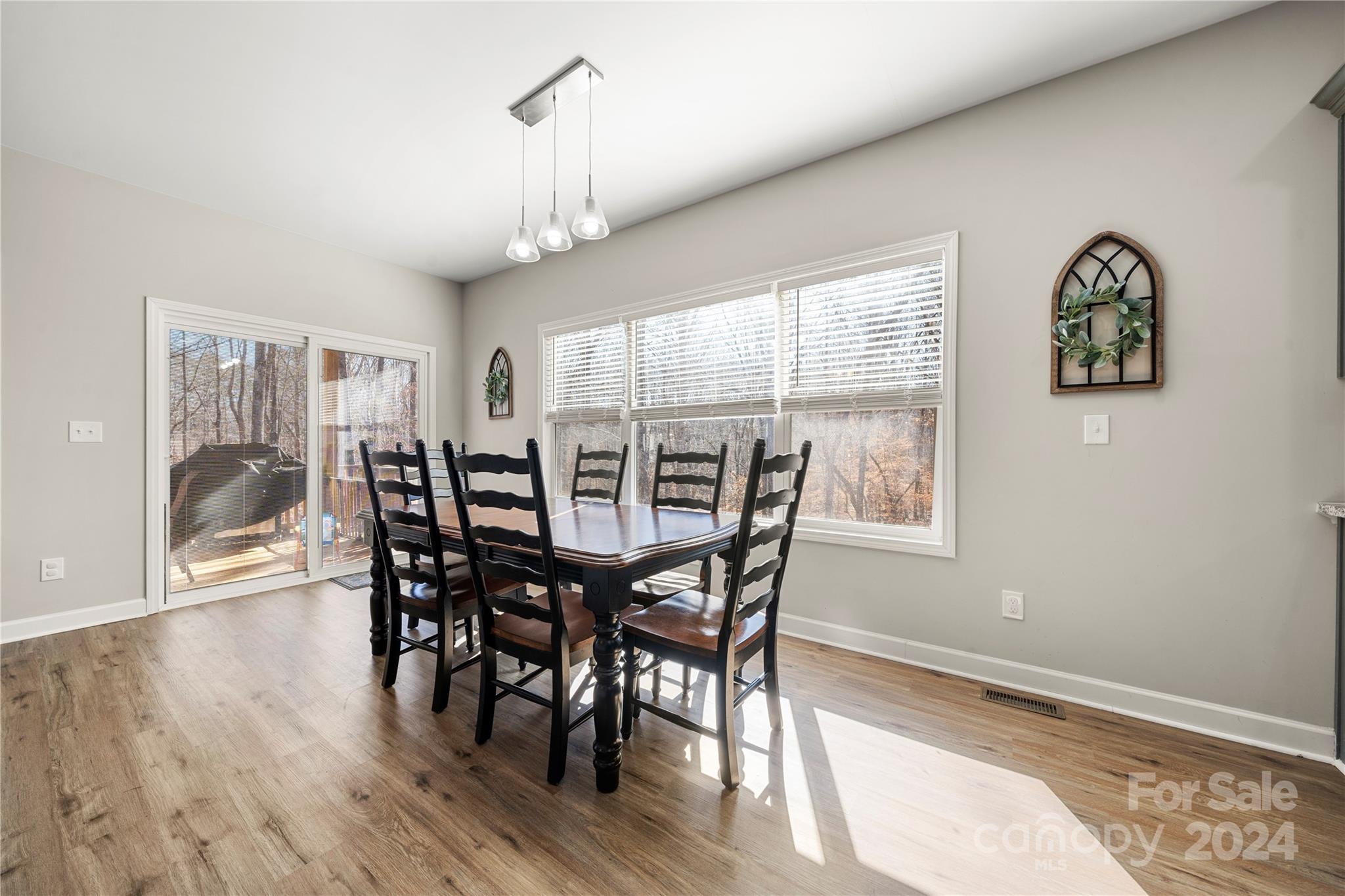 218 Rambler Lane Blacksburg, SC 29702 - Photo 19 of 42 a view of a dining room with furniture window and wooden floor