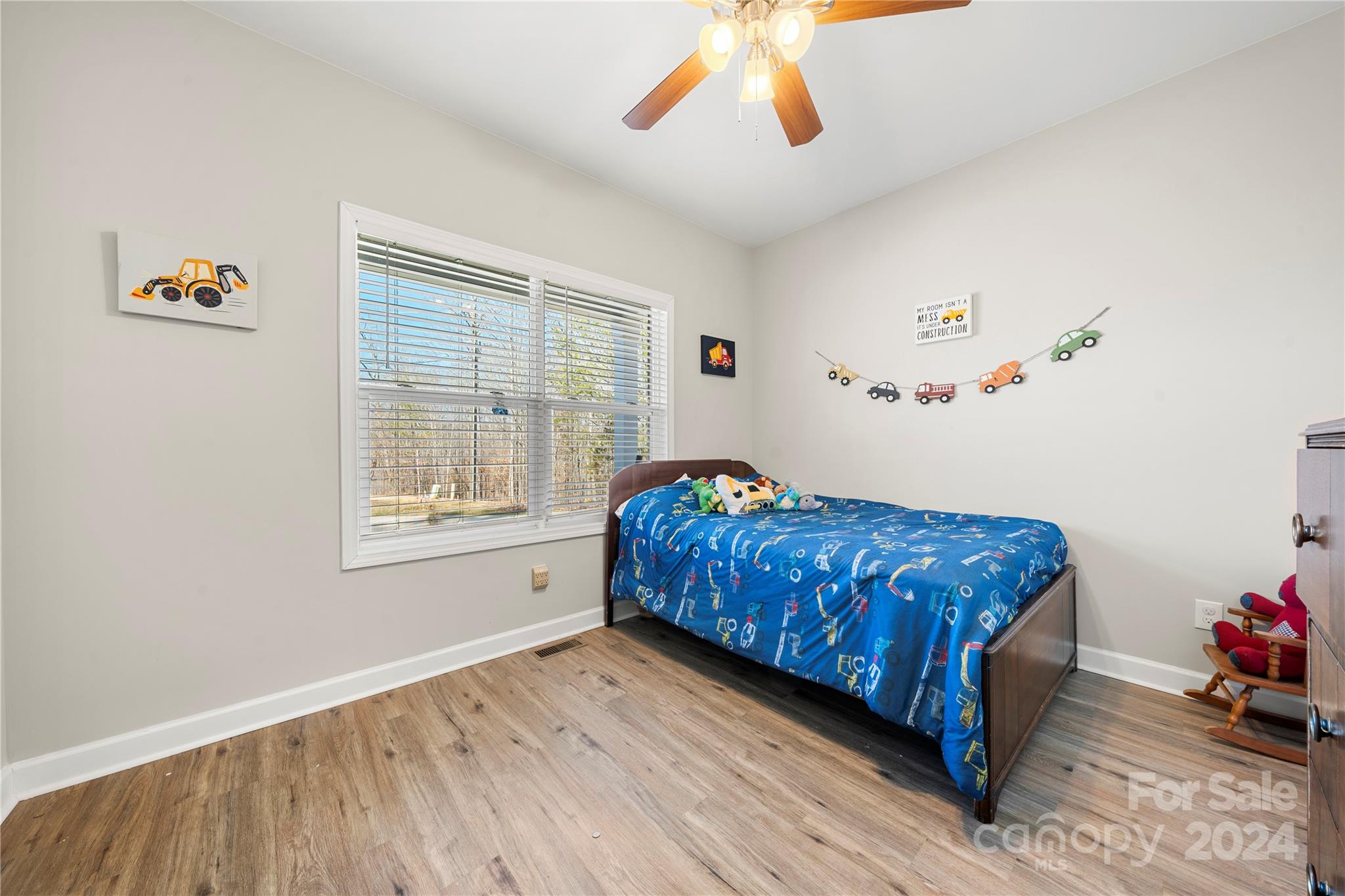 218 Rambler Lane Blacksburg, SC 29702 - Photo 24 of 42 a bedroom with a bed and a chandelier