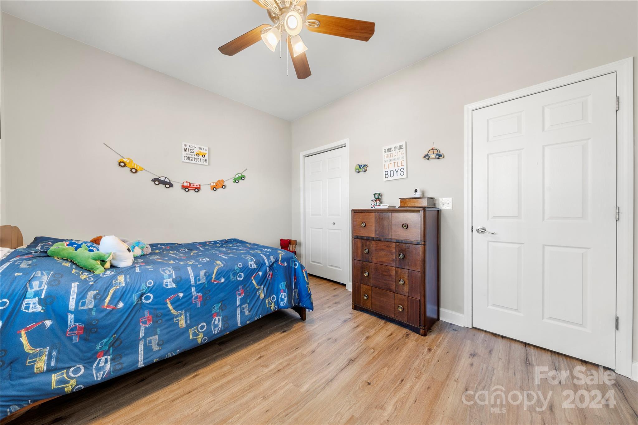 218 Rambler Lane Blacksburg, SC 29702 - Photo 25 of 42 a bedroom with a bed and wooden floor