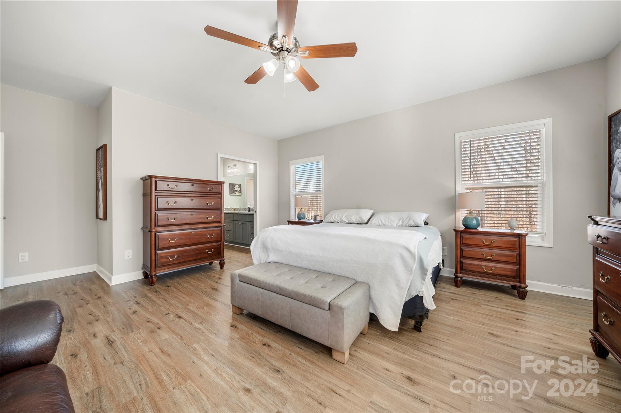 218 Rambler Lane Blacksburg, SC 29702 - Photo 27 of 42 a spacious bedroom with a bed and a chandelier