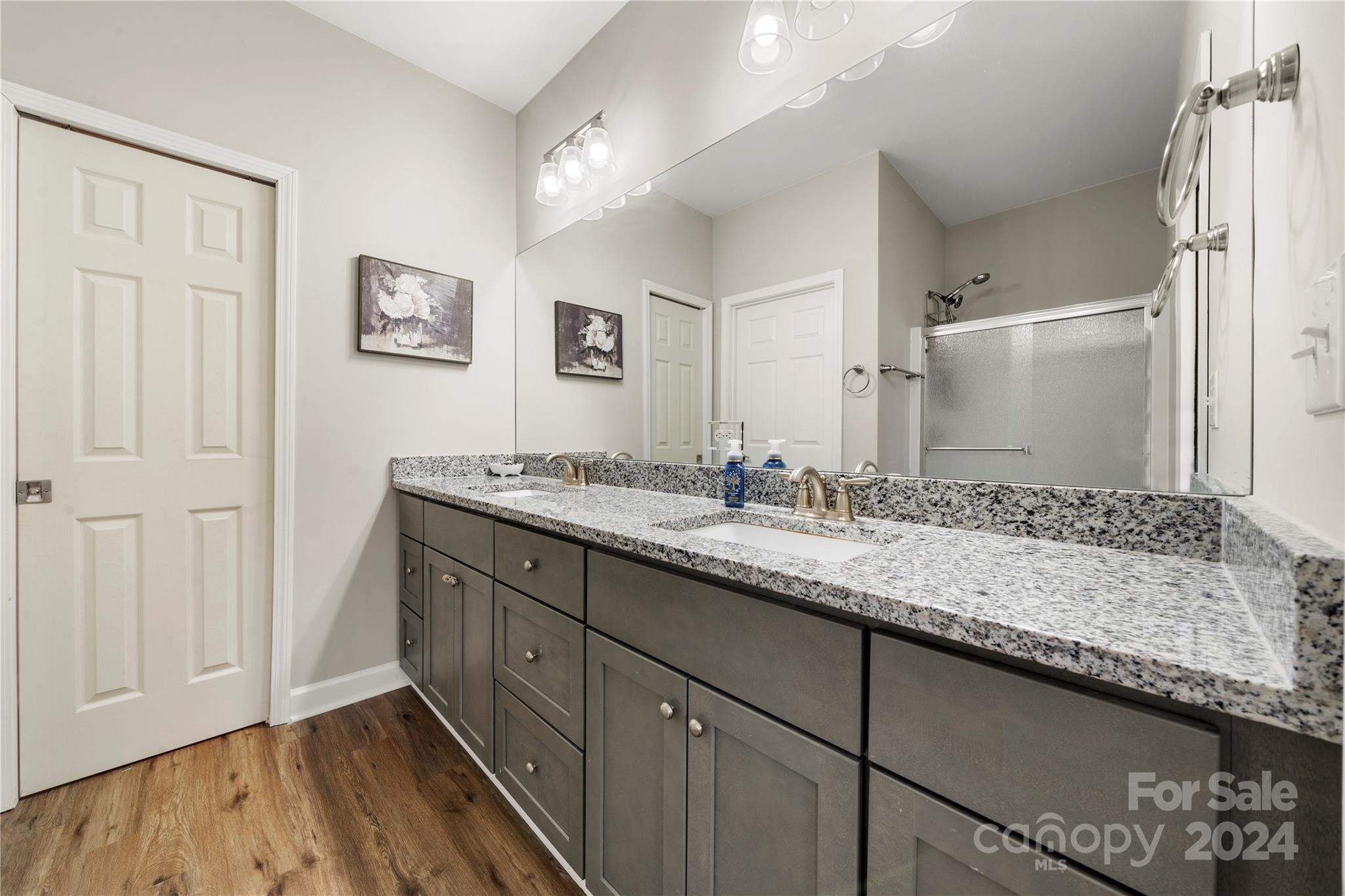 218 Rambler Lane Blacksburg, SC 29702 - Photo 30 of 42 a bathroom with a granite countertop double vanity sink and mirror