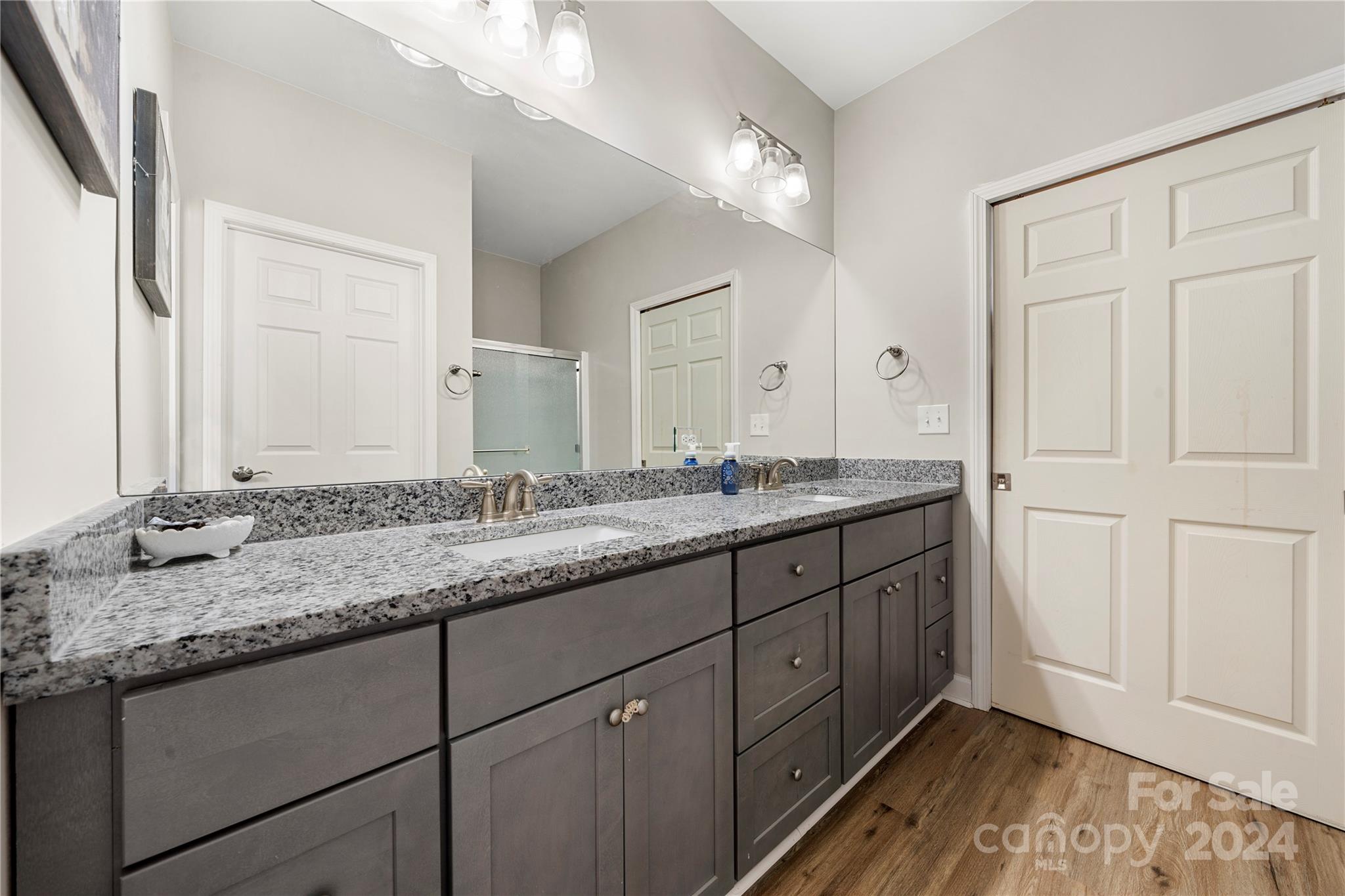 218 Rambler Lane Blacksburg, SC 29702 - Photo 32 of 42 a bathroom with a granite countertop double vanity sink and mirror