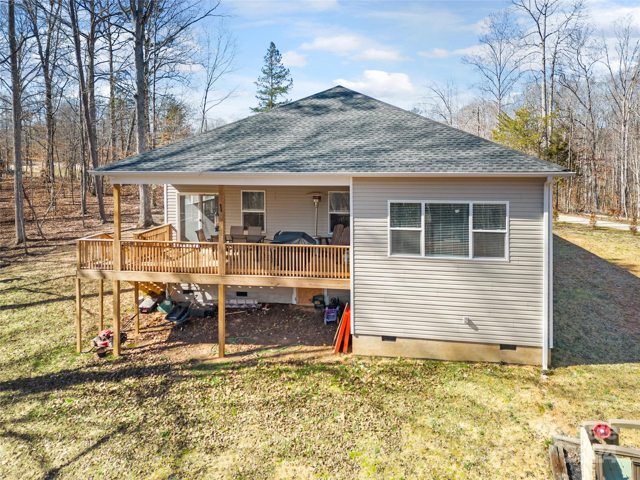 218 Rambler Lane Blacksburg, SC 29702 - Photo 33 of 42 a backyard of a house with barbeque oven table and chairs