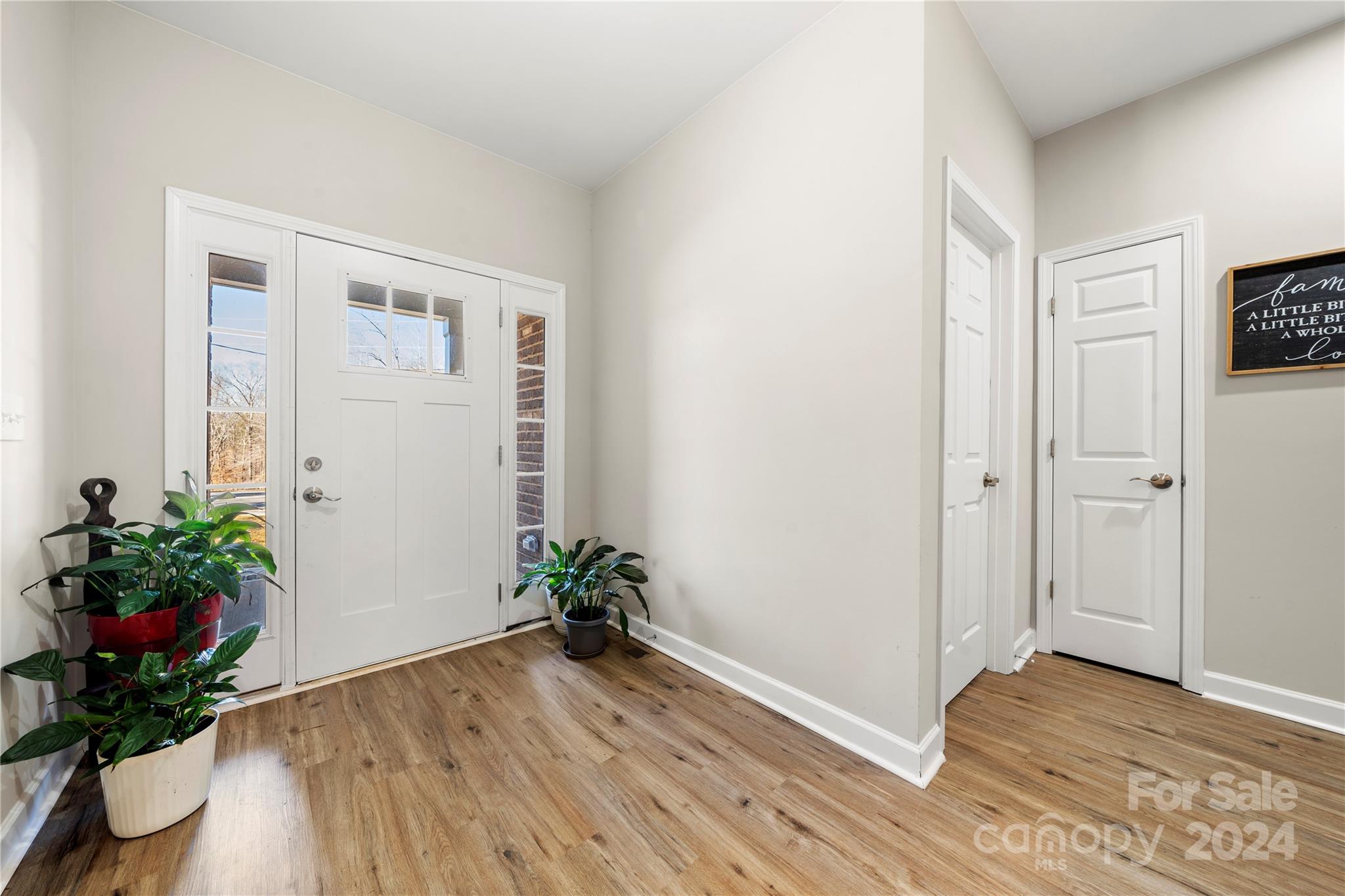 218 Rambler Lane Blacksburg, SC 29702 - Photo 4 of 42 a living room with wooden floor and a potted plant