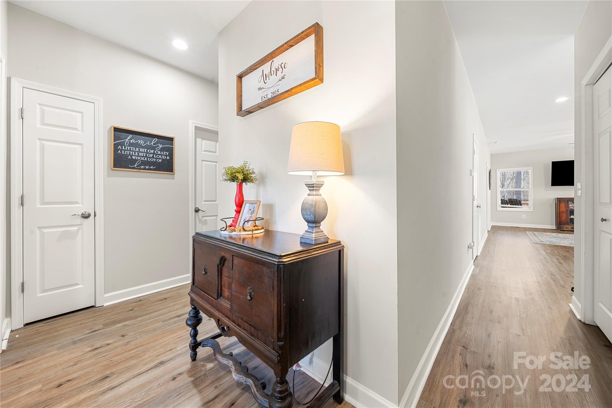 218 Rambler Lane Blacksburg, SC 29702 - Photo 5 of 42 a view of hallway with furniture and wooden floor