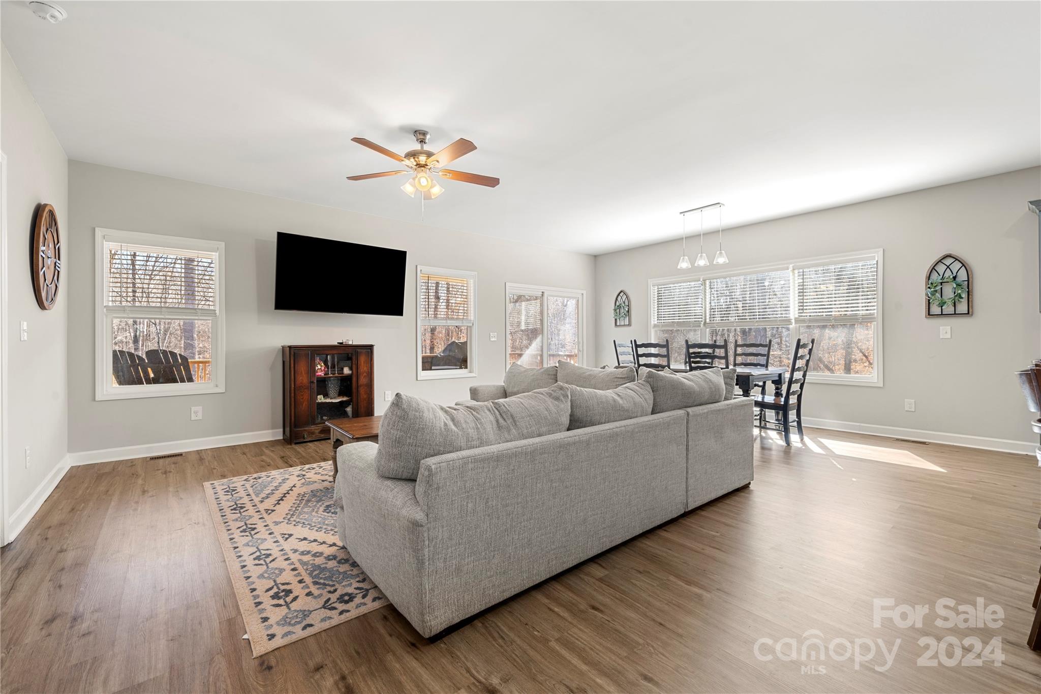 218 Rambler Lane Blacksburg, SC 29702 - Photo 7 of 42 a living room with furniture a fireplace and a flat screen tv