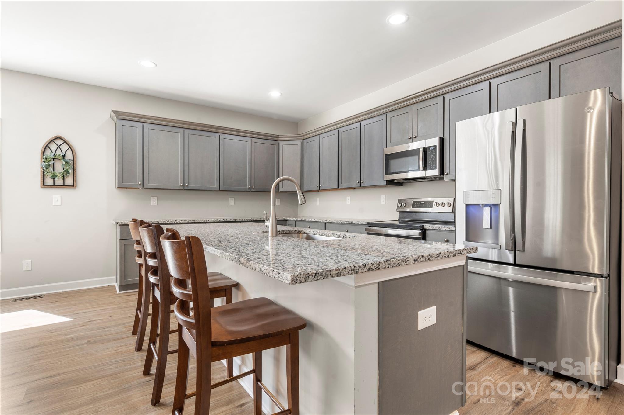 218 Rambler Lane Blacksburg, SC 29702 - Photo 10 of 42 a kitchen with stainless steel appliances granite countertop a refrigerator a stove a sink and a microwave