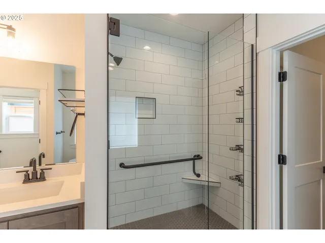 a bathroom with a bathtub and shower