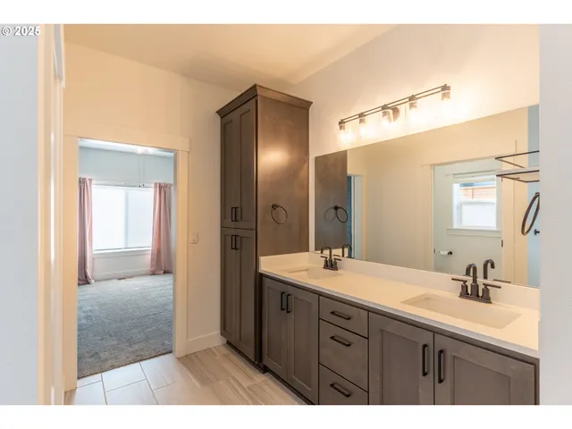 a bathroom with a sink toilet a shower and a mirror