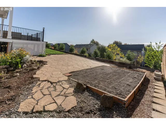 an aerial view of a house with a yard basket ball court and outdoor seating