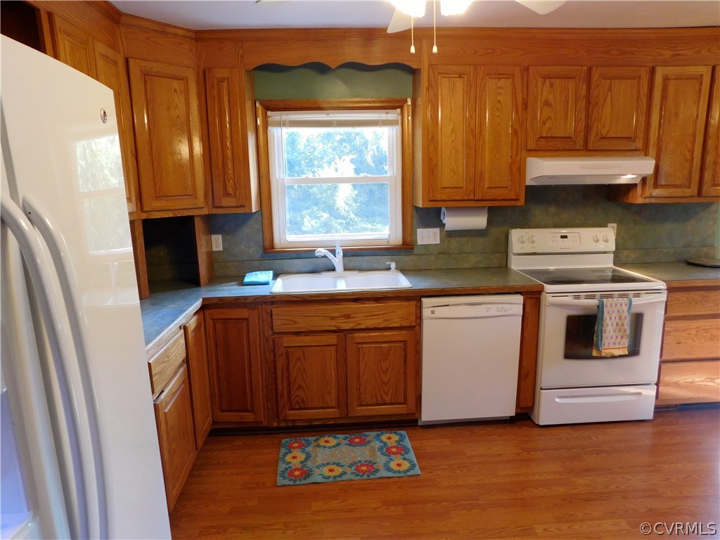 8311 Hopkins Road North Chesterfield, VA 23237 - Photo 15 of 39 a kitchen with granite countertop a refrigerator stove and sink