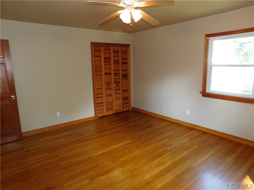 8311 Hopkins Road North Chesterfield, VA 23237 - Photo 19 of 39 an empty room with wooden floor and windows