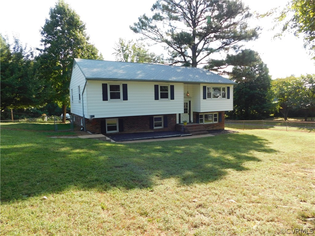 8311 Hopkins Road North Chesterfield, VA 23237 - Photo 2 of 39 a view of a yard in front of a house with large trees