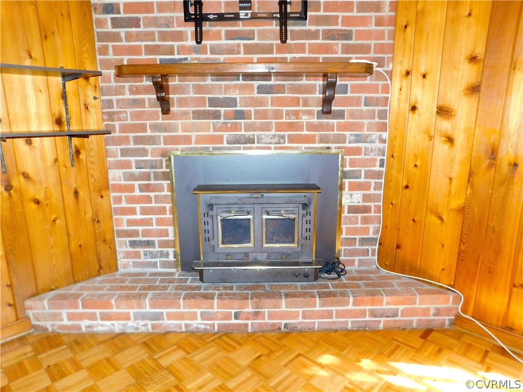 8311 Hopkins Road North Chesterfield, VA 23237 - Photo 27 of 39 a view of a fireplace with wooden floor