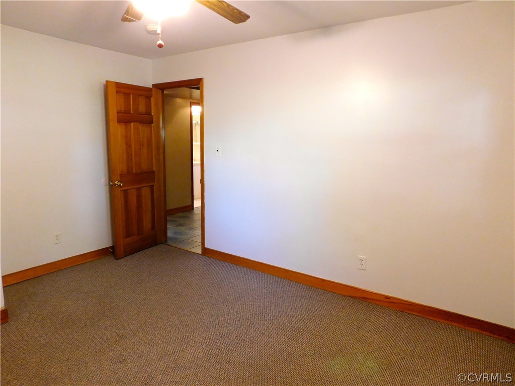 8311 Hopkins Road North Chesterfield, VA 23237 - Photo 34 of 39 an empty room with chandelier fan