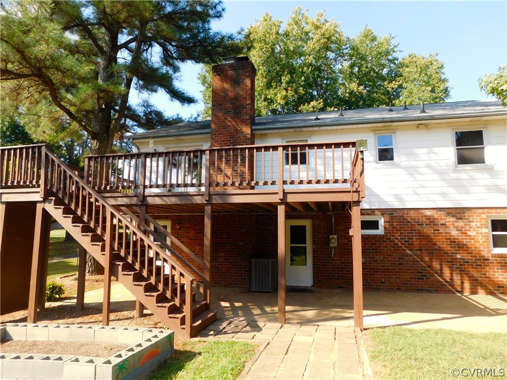 8311 Hopkins Road North Chesterfield, VA 23237 - Photo 35 of 39 a balcony with wooden floor and outdoor seating