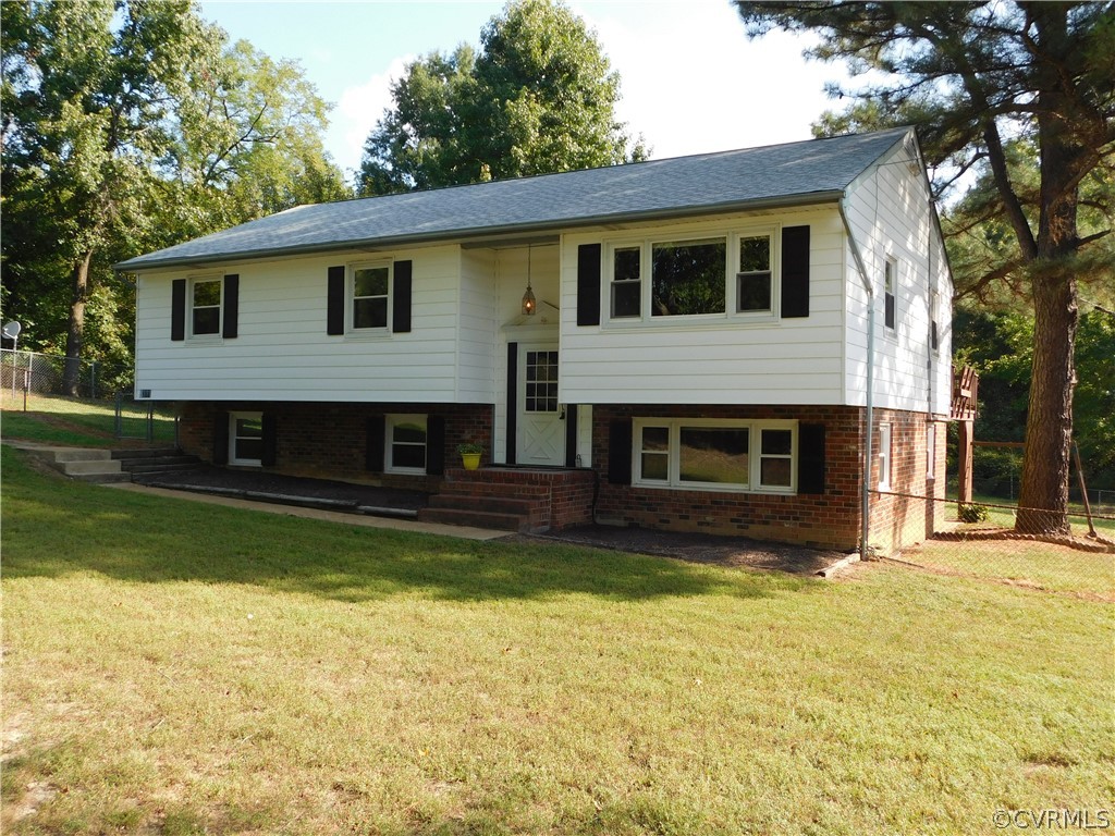 8311 Hopkins Road North Chesterfield, VA 23237 - Photo 4 of 39 a view of a house with a yard and a fireplace