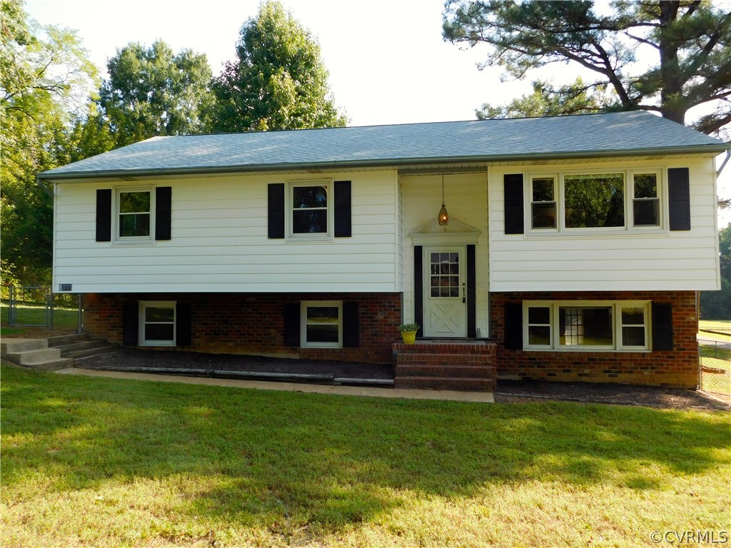 8311 Hopkins Road North Chesterfield, VA 23237 - Photo 5 of 39 a front view of a house with a yard