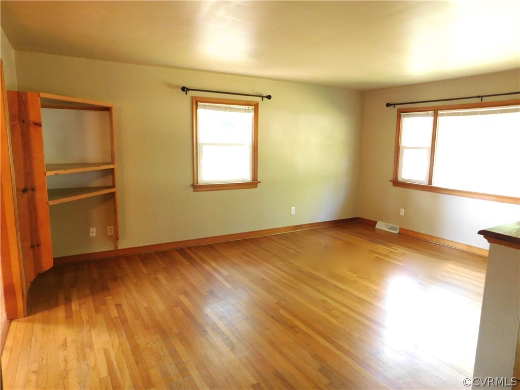 8311 Hopkins Road North Chesterfield, VA 23237 - Photo 8 of 39 a view of empty room with wooden floor and fan