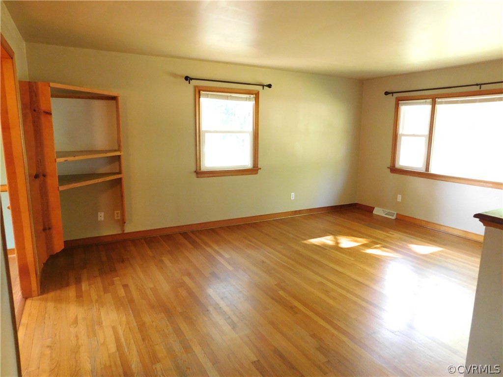 8311 Hopkins Road North Chesterfield, VA 23237 - Photo 9 of 39 a view of empty room with wooden floor and fan