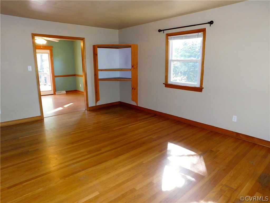 8311 Hopkins Road North Chesterfield, VA 23237 - Photo 10 of 39 a view of empty room with wooden floor and fan