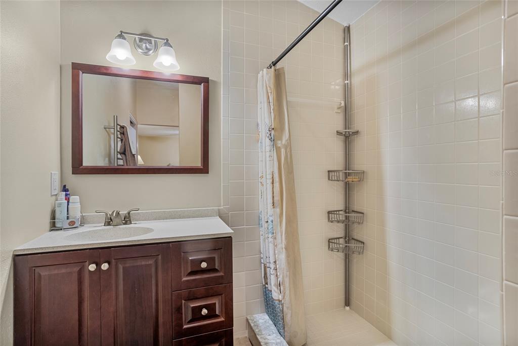 14612 Bray Road Orlando, FL 32832 - Photo 21 of 33 a bathroom with a sink vanity and a mirror