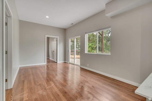 2154 Wasatch Boulevard Sandy, UT 84092 - Photo 47 of 55 Unfurnished bedroom featuring access to outside, light wood-style flooring, and recessed lighting