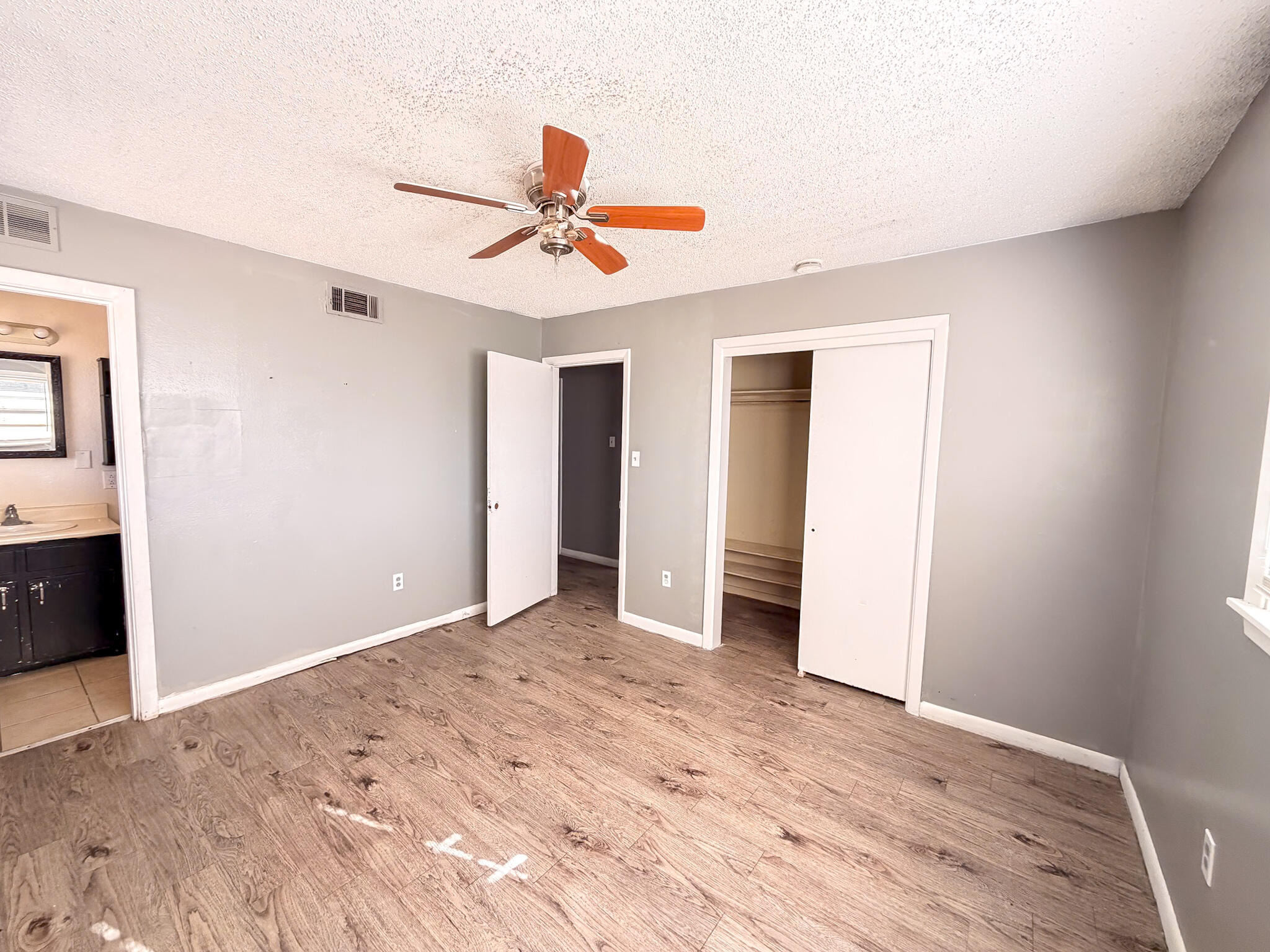 2805 53rd Street Lubbock, TX 79413 - Photo 4 of 13 a view of room with a ceiling fan and a window
