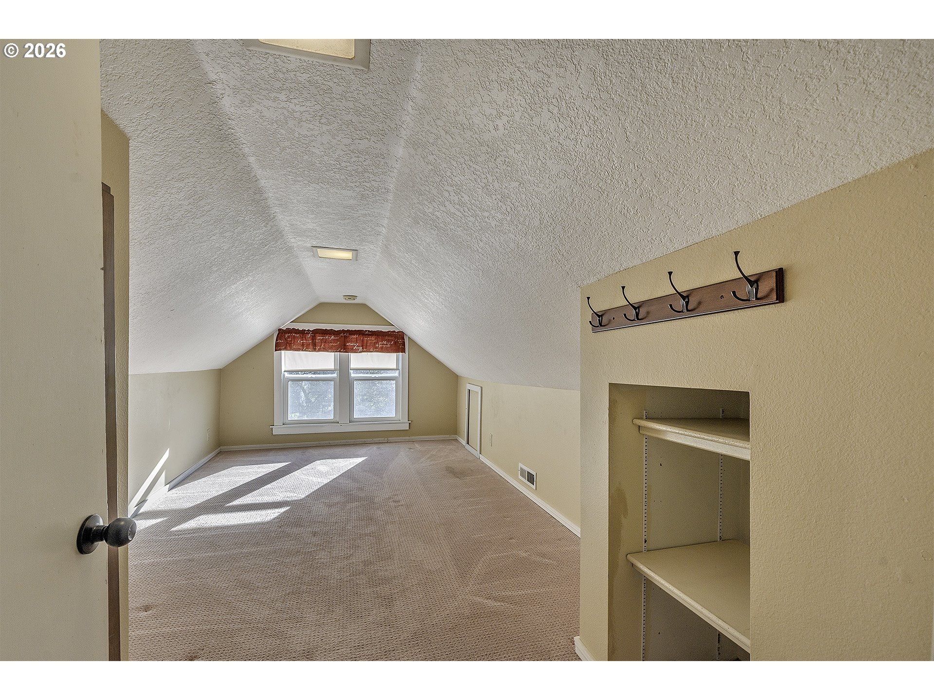 58059 Shadley Lane Warren, OR 97053 - Photo 21 of 33 a bedroom with a bed and a window