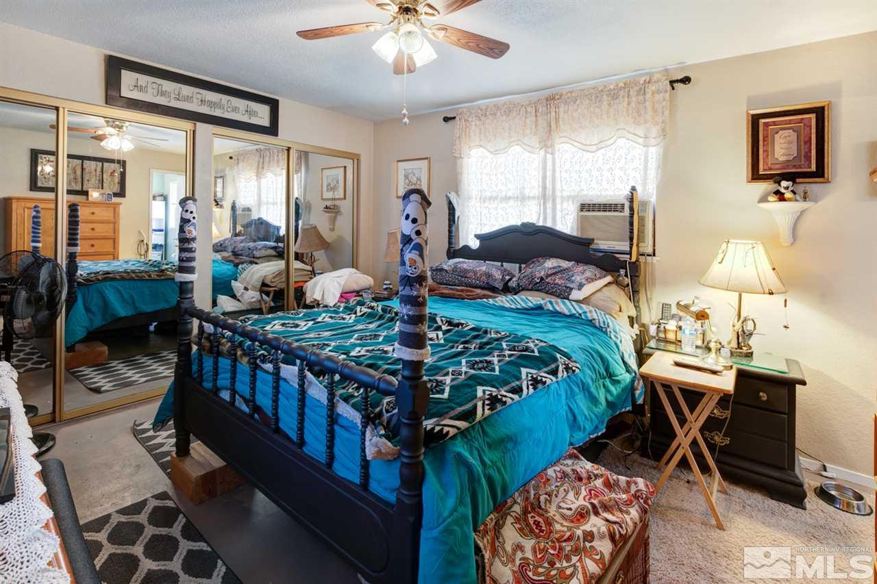 1096 Rice Road Fallon, NV 89406 - Photo 14 of 24 a bedroom with furniture and a window
