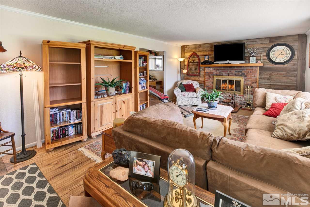 1096 Rice Road Fallon, NV 89406 - Photo 6 of 24 a living room with furniture a window and bookshelf