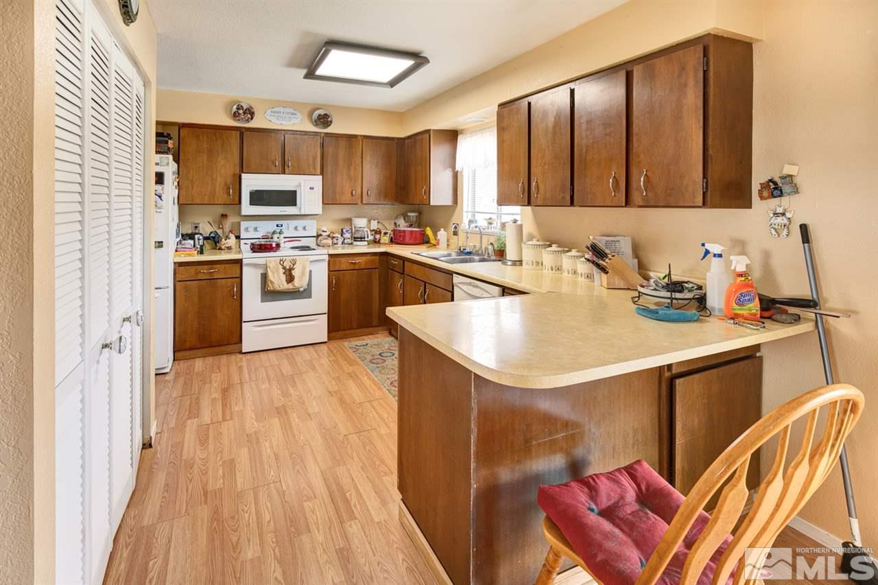 1096 Rice Road Fallon, NV 89406 - Photo 7 of 24 a kitchen with a sink appliances cabinets and furniture