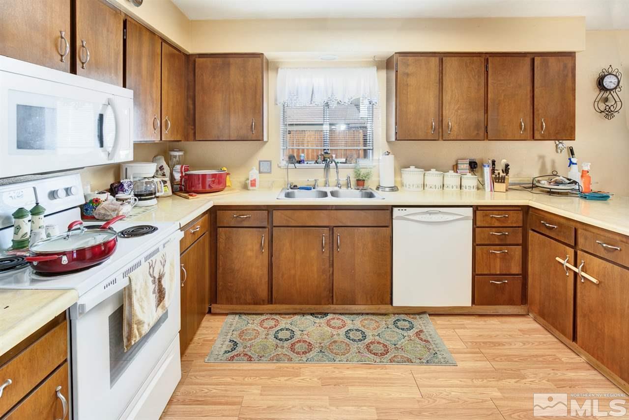 1096 Rice Road Fallon, NV 89406 - Photo 8 of 24 a kitchen with a sink stove and cabinets