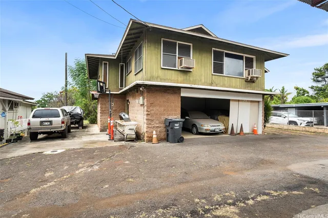 a view of a car park in front of house