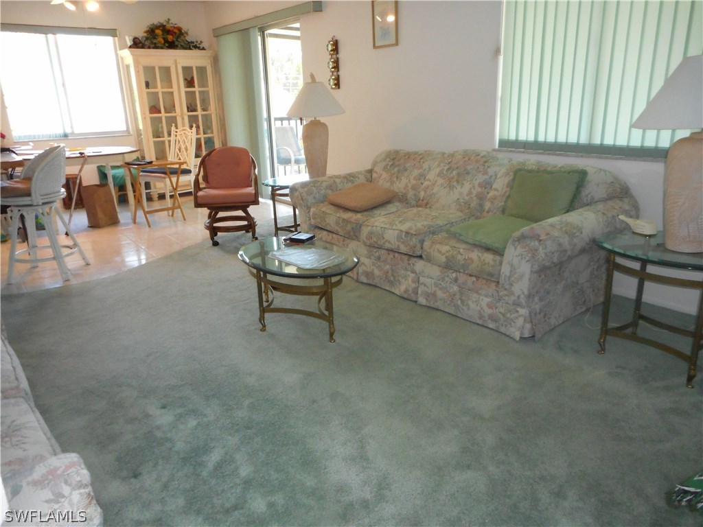 8470 Robin Road Fort Myers, FL 33967 - Photo 12 of 24 a living room with furniture and a large window