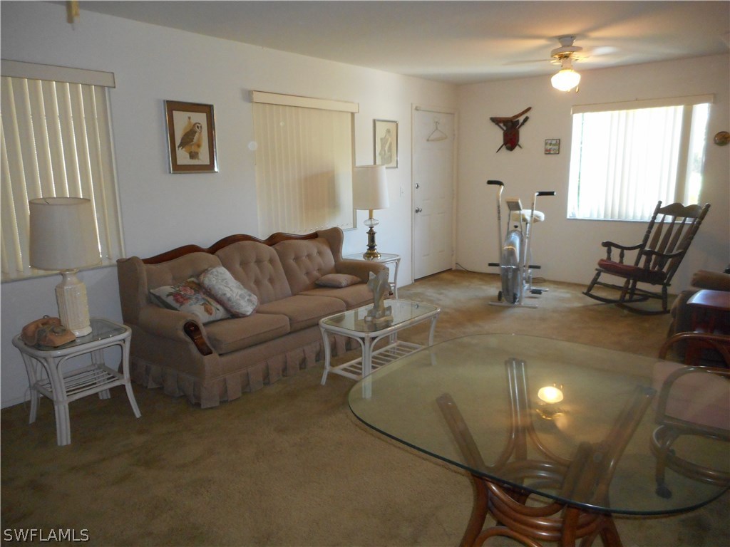 8470 Robin Road Fort Myers, FL 33967 - Photo 14 of 24 a living room with furniture and a dining table