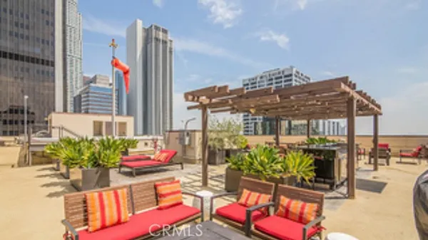 a view of a chairs and table in a patio