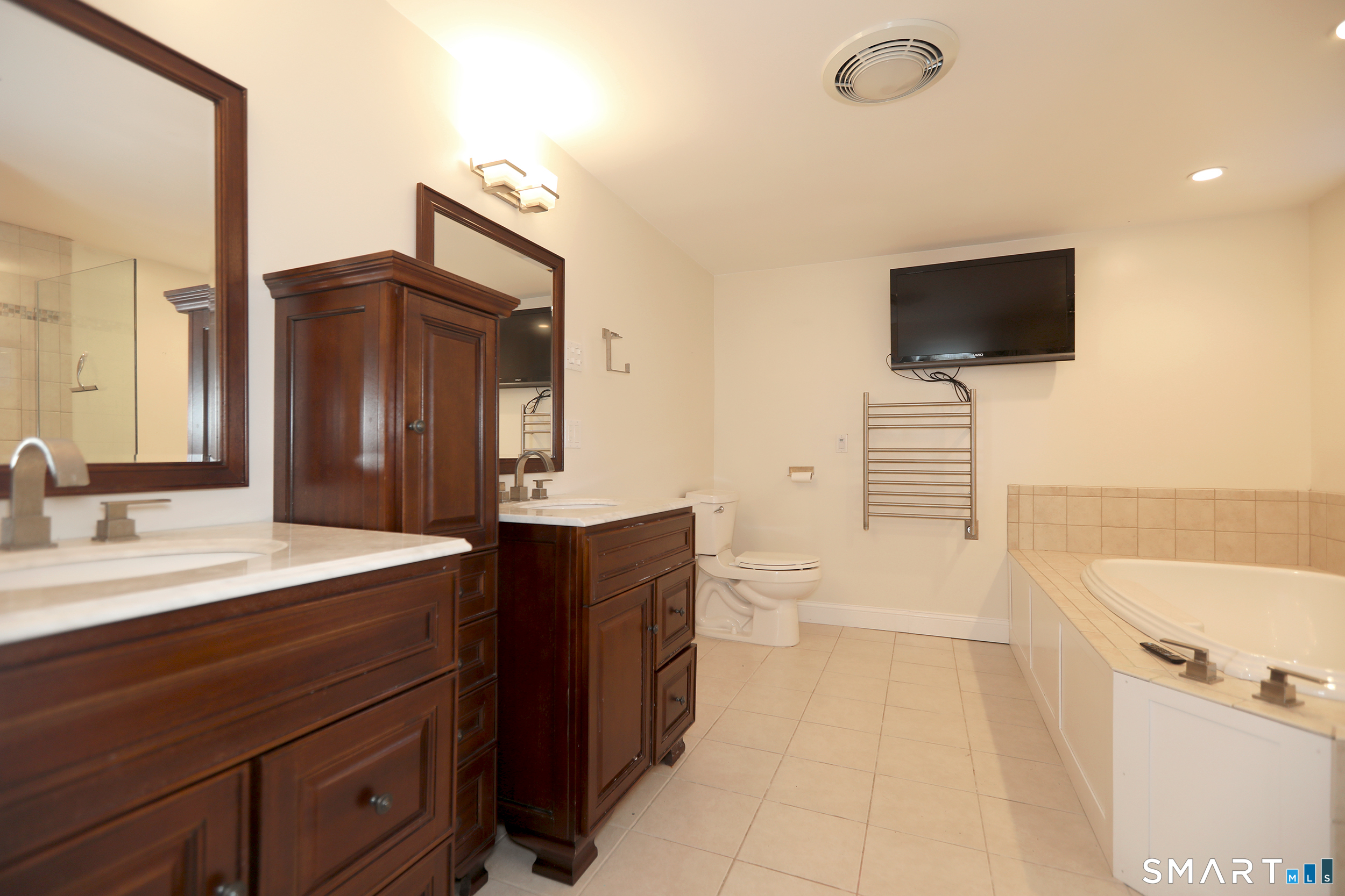 60 Ferguson Road Manchester, CT 06040 - Photo 11 of 18 This lovely bathroom has been completely remodeled. New vanity, soaking tub, radiant floors, warming towel rack, tile shower with rainfall shower head and more!