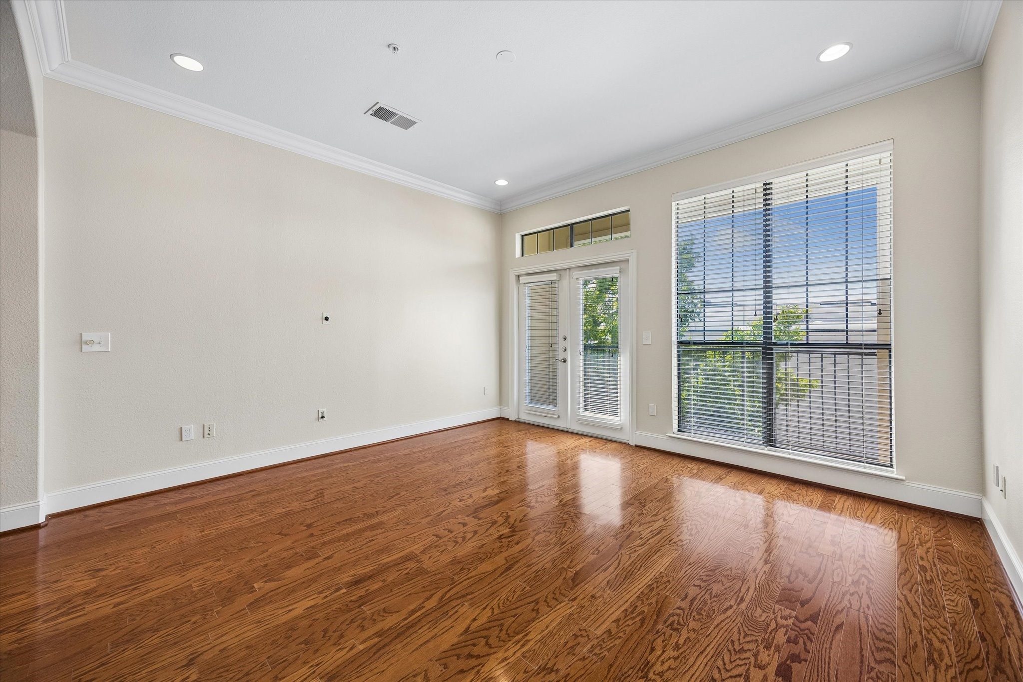 2120 Kipling Street, Unit 207 Houston, TX 77098 - Photo 1 of 35 Generous sized living room with a south facing balcony and tons of natural lighting
