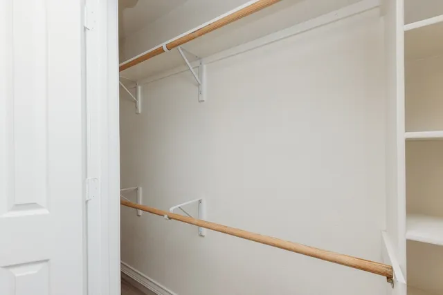 a view of an empty walk in closet