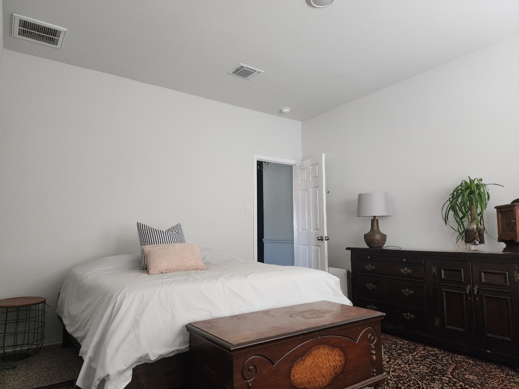 136 Ragnar Drive Jarrell, TX 76537 - Photo 8 of 10 a bedroom with a bed and a dresser