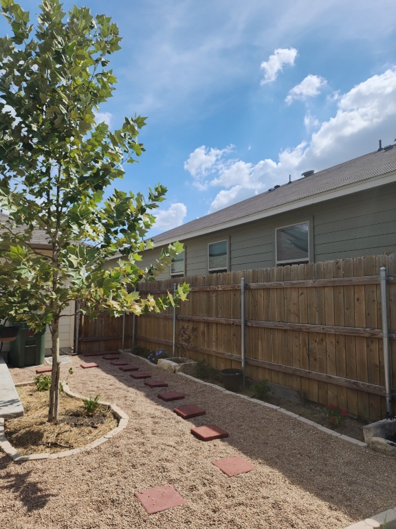 136 Ragnar Drive Jarrell, TX 76537 - Photo 9 of 10 a view of backyard with pathway