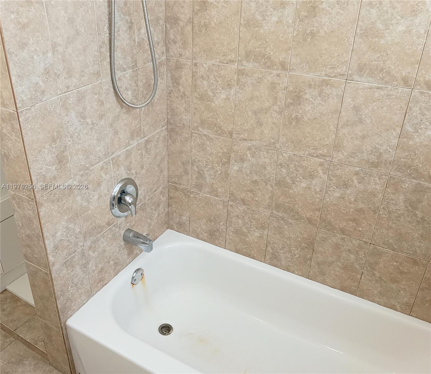 2346 Southwest 20th Street Miami, FL 33145 - Photo 12 of 14 a bathroom with a white bath tub and a shower