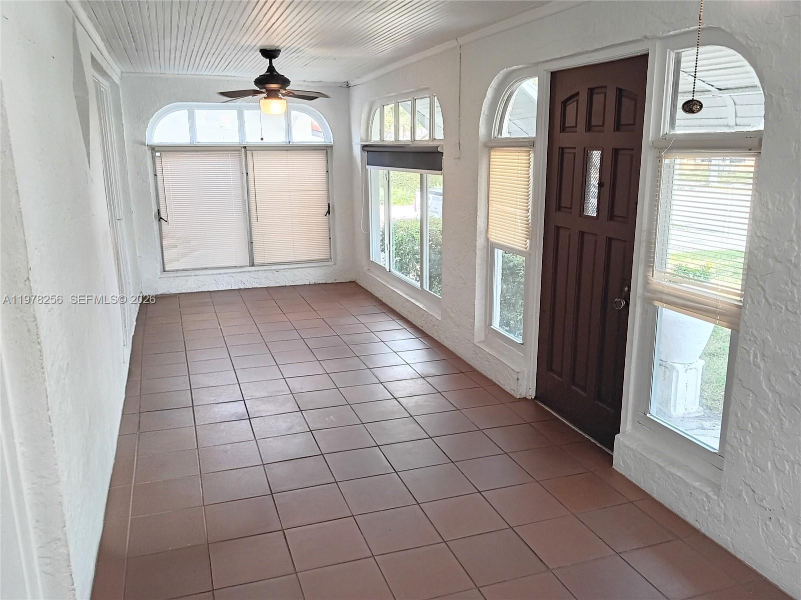 2346 Southwest 20th Street Miami, FL 33145 - Photo 2 of 14 a view of entryway with wooden floor and windows