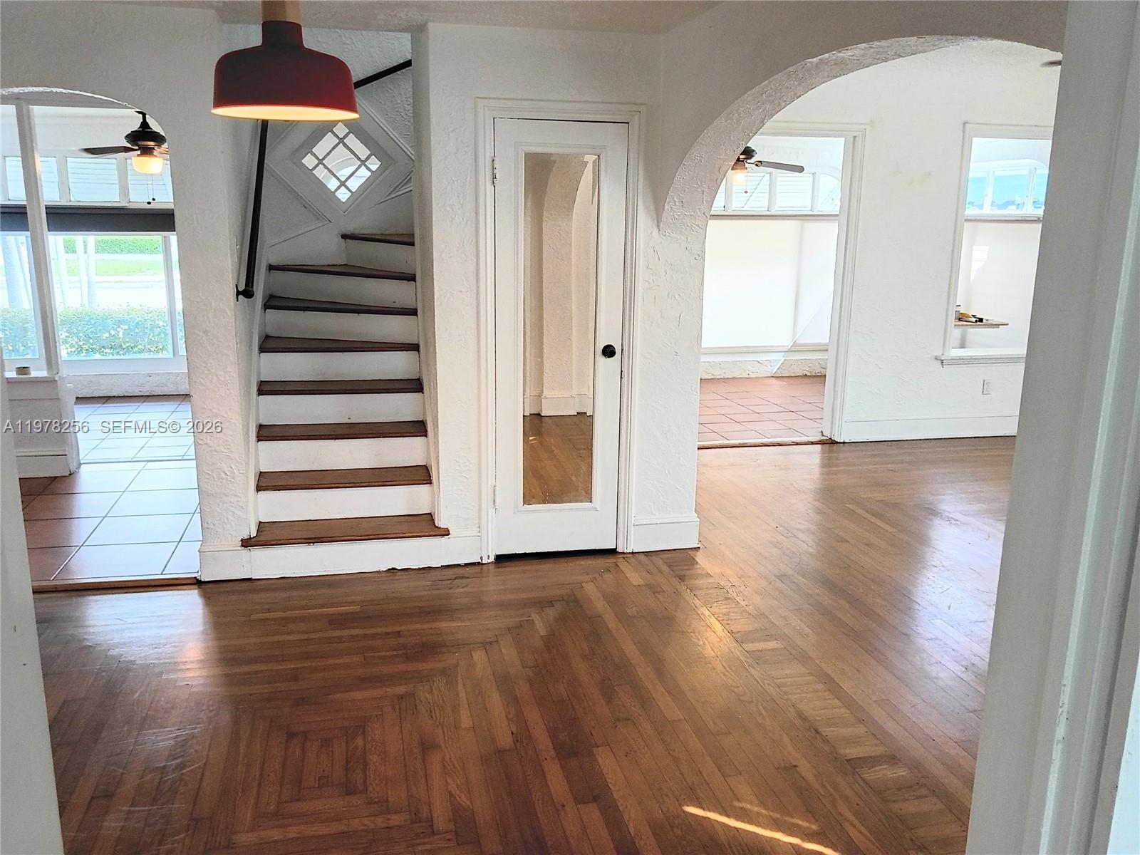 2346 Southwest 20th Street Miami, FL 33145 - Photo 5 of 14 wooden floor in an empty room with a window