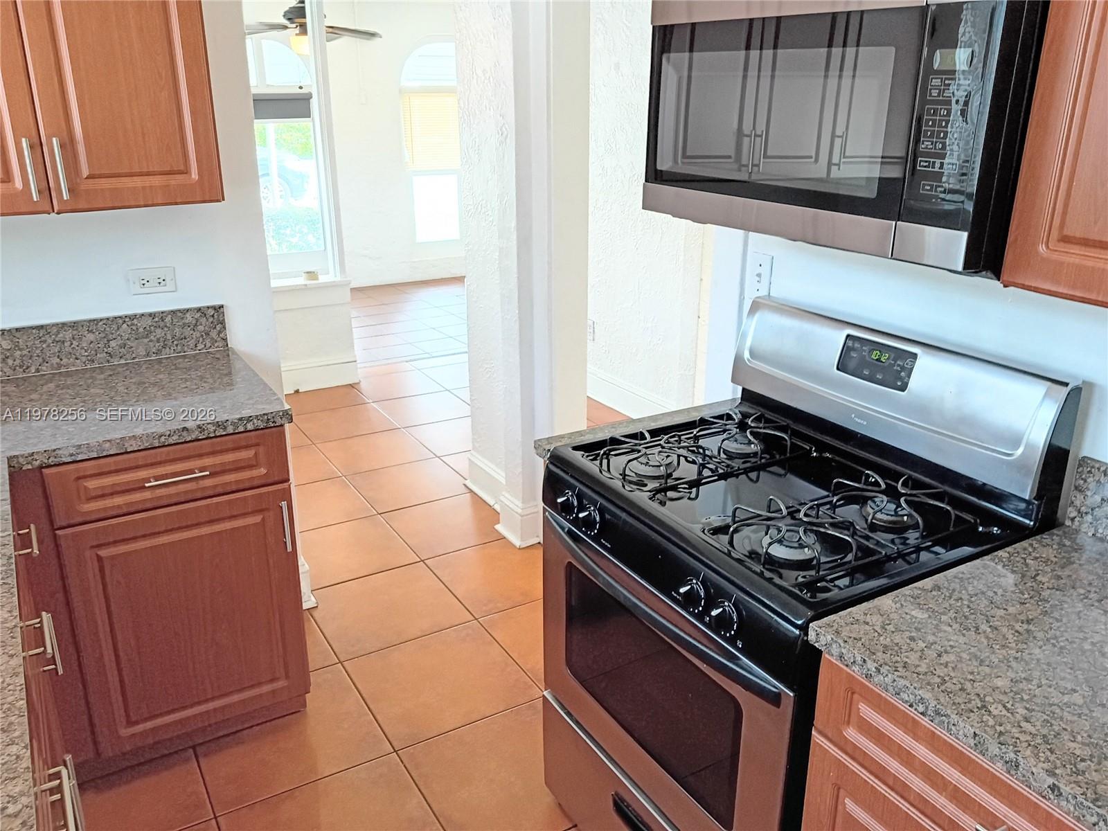 2346 Southwest 20th Street Miami, FL 33145 - Photo 7 of 14 a stove top oven sitting inside of a kitchen