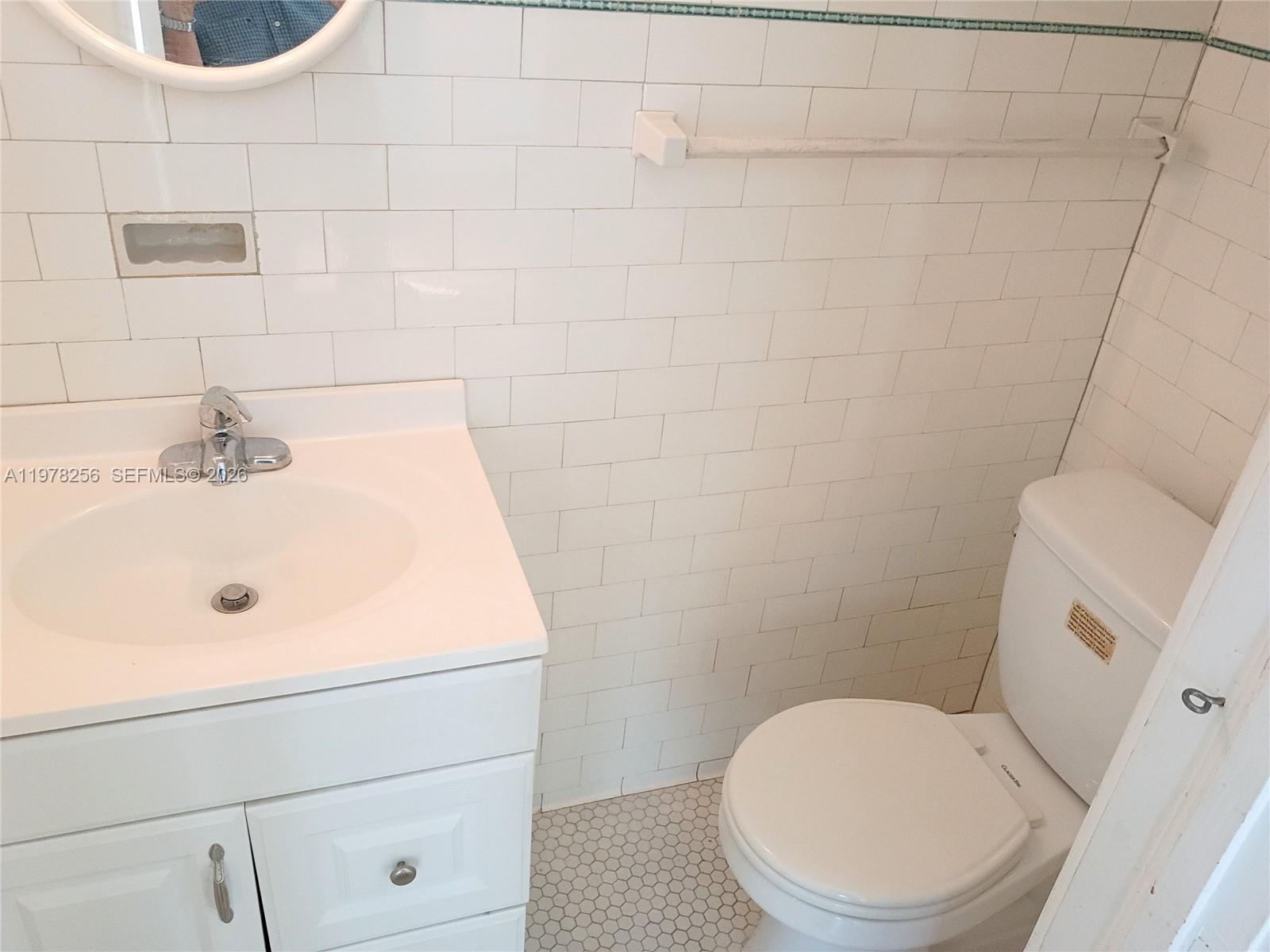 2346 Southwest 20th Street Miami, FL 33145 - Photo 10 of 14 a bathroom with a toilet and a sink