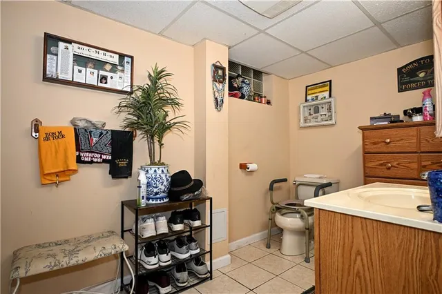a bathroom with a sink mirror and vanity