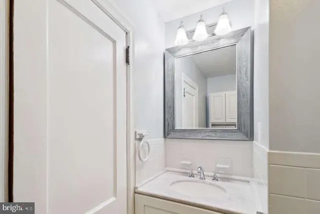a bathroom with a glass shower door